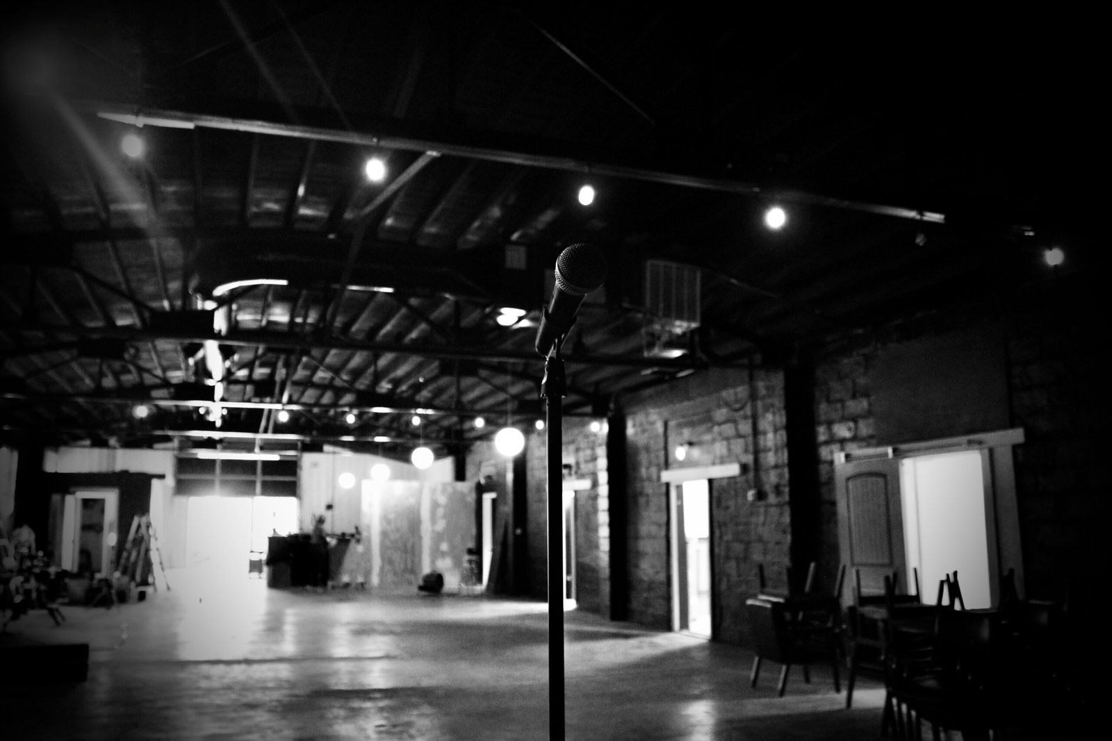 Stage with microphone and industrial ceiling